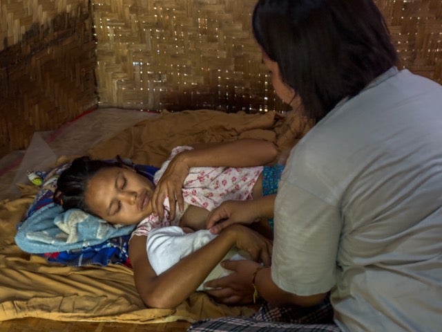 Yu Yu provides care for a newborn baby and the mother after her delivery in an emergency. Photo © UNFPA Myanmar