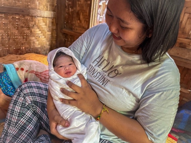A baby was delivered safely in a community affected by an earthquake in Mandalay, thanks to Yu Yu, a local midwife supported by UNFPA. Photo © UNFPA Myanmar