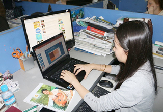 Ms. Aye Thidar Kyaw works with data to write her story on electricity supply and consumption for the Myanmar Times