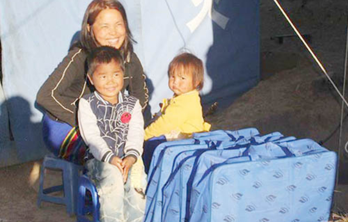 Dawt Hnem and her children live in a tent, which is excruciatingly cold in the winter. Credit: ©IOM