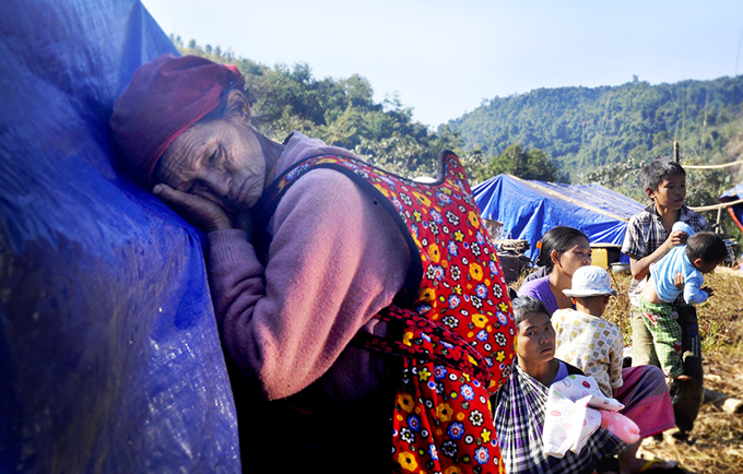 Families, including pregnant women, children, and disabled and elderly people, flee shelling and airstrikes in northern Myanmar’s Kachin State.