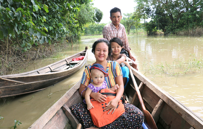 Phoo Ngun with her family in 2016: In the wake of last year’s floods, she gave birth safely to a baby daughter.