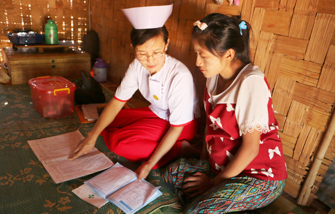 Midwife Nan Mya Phyu discusses family planning with Nan Aye Aye Han in Nam Khoke Village, Shan State, Myanmar.