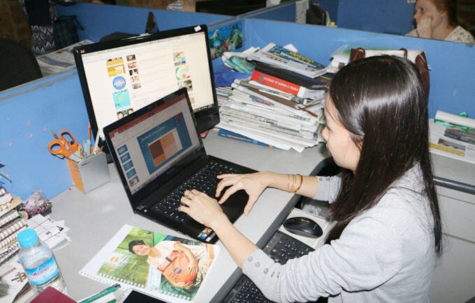 Ms. Aye Thidar Kyaw works with data to write her story on electricity supply and consumption for the Myanmar Times