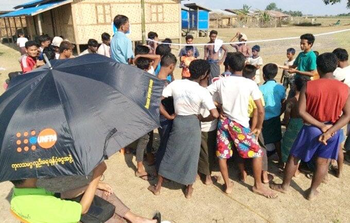 Young people enjoying Chin Lone while learning about HIV and STI prevention in Thet Kal Pyin camp, Sittwe.