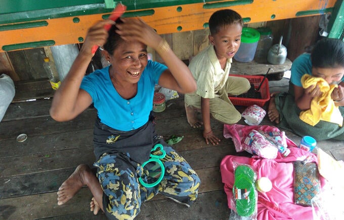 A comb and a mirror go a long way towards a sense of dignity for this woman in Sin Pite village in Myanmar’s Rakhine State.