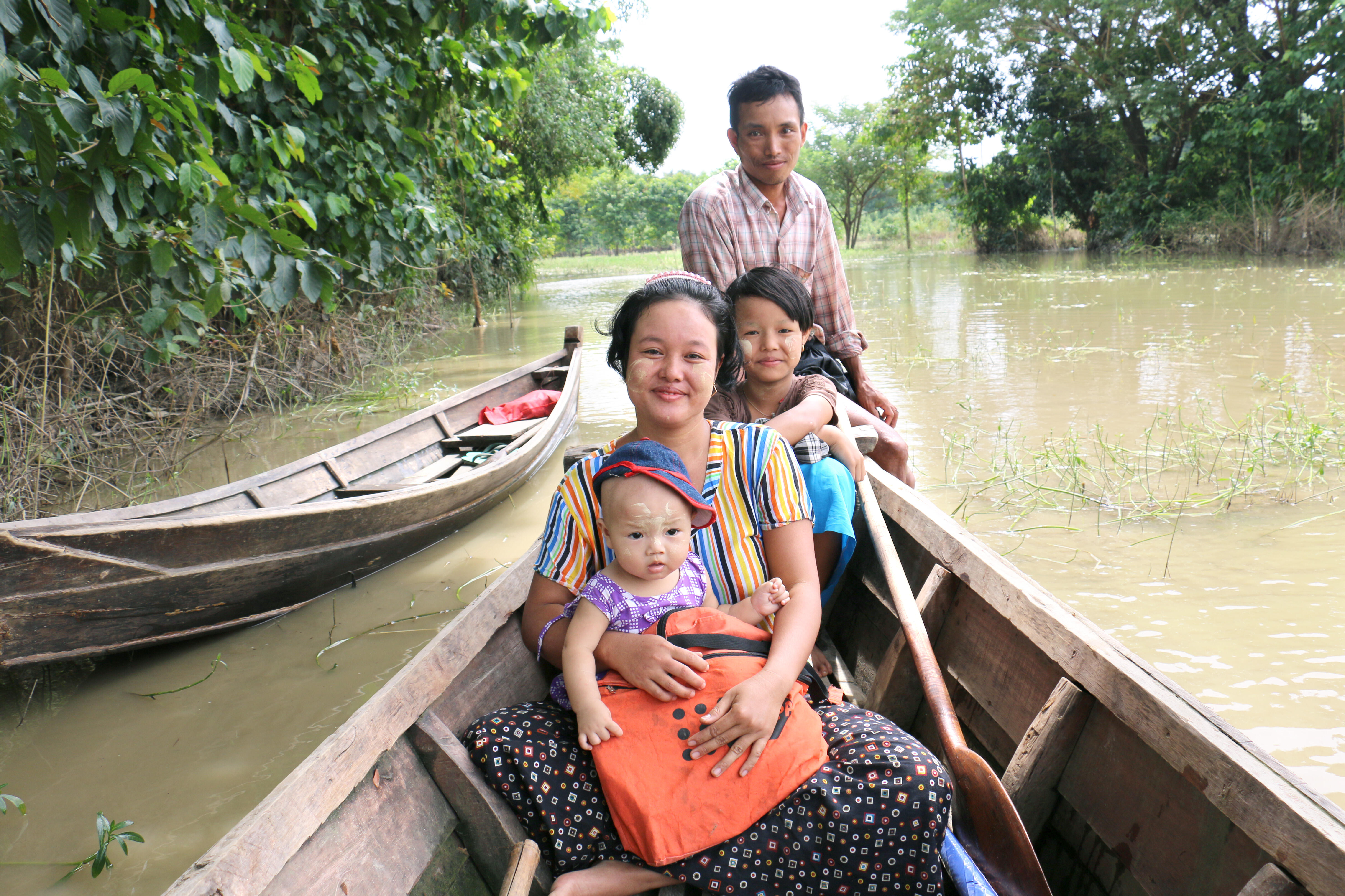 Phoo Ngun with her family in 2016: In the wake of last year’s floods, she gave birth safely to a baby daughter.